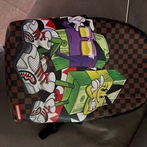 Sprayground Brown Checkered Backpack with Graphic Design